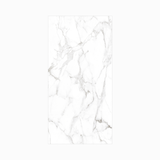 Statuario Marble 120x240cm glossy tile with bold grey veining on white. Perfect for walls and floors, adding timeless elegance to modern interiors.