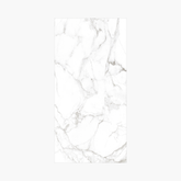 Statuario Marble 120x240cm glossy tile with bold grey veining on white. Perfect for walls and floors, adding timeless elegance to modern interiors.